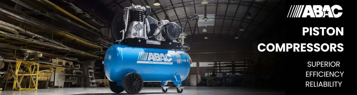 ABAC piston compressor in a warehouse setting with the brand name displayed.
